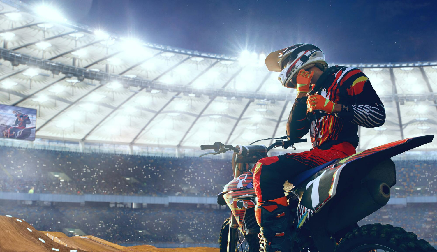 Imagem ilustrativa sobre capacete de motocross mostrando um competidor ajustando seu capacete para garantir maior segurança.